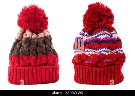 Two red winter ski knit hat isolated white Stock Photo