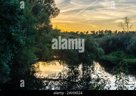 Amazing sunset view on river in countryside Stock Photo