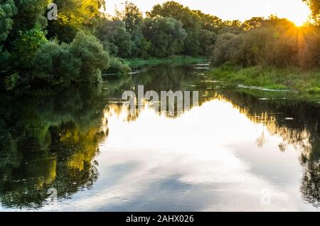 Amazing sunset view on river in countryside Stock Photo