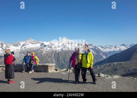 Chinese tourists take a selfie in Gornetgrat observatory. Matterhorn Massif. Switzerland Stock Photo