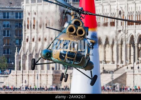 BUDAPEST / HUNGARY - JULY 4, 2015: Hungarian Air Force Mil Mi-8 3301 transport helicopter display over Danube river in Budapest downtown Stock Photo