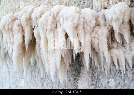 Salt stalactites forming on the Dead Sea coast.  The Sea has the lowest elevation on earth. Stock Photo