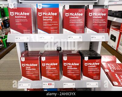 Montreal, Canada - December 26, 2019: McAfee products on shelves in store. McAfee is an American global computer security software company headquarter Stock Photo