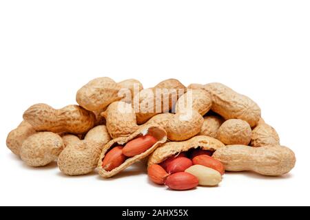 Large peeled peanuts close-up of beans in the shell isolated on white background . Unpeeled peanuts in the shell. Peanuts, for background or texture Stock Photo