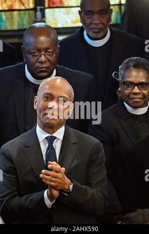 Charleston, United States. 01 January, 2020. Democratic presidential hopeful Gov. Deval Patrick of Massachusetts, left, joins in the worship service at the historic Mother Emanuel AME Church January 1, 2020 in Charleston, South Carolina. The service celebrated Emancipation Day, marking the abolition of slavery in the United States.  Credit: Richard Ellis/Alamy Live News Stock Photo