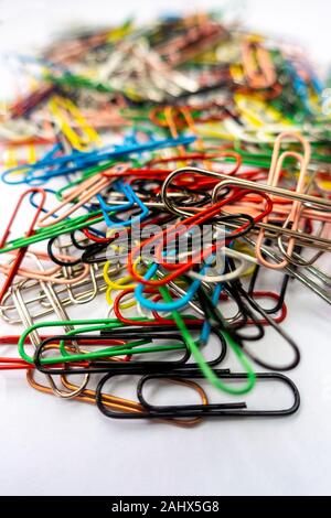 A pile of paper clips against a white background. Stock Photo