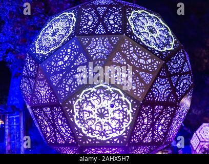 Enchanted forest of light - brightly illuminated intricate metal structure Stock Photo