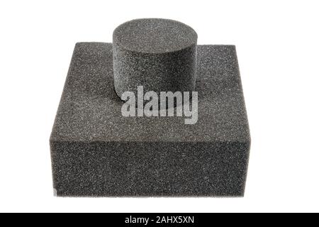 Technical Round Sponge. Black sponge foam in a shape of electronic or computer part, a protective equipment on white background. Stock Photo