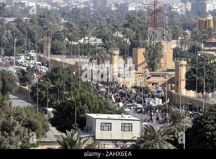 Baghdad, Iraq. 01st Jan, 2020. Assailants and attackers storm the entry control point at the U.S. Embassy in Baghdad, Iraq, on January 1, 2020. Dozens of angry Iraqi Shiite militia supporters broke into the U.S. Embassy compound in Baghdad on Tuesday, December 31, 2019, after smashing a main door and setting fire to a reception area. Photo by Maj. Charlie Dietz/U.S. Army/UPI Credit: UPI/Alamy Live News Stock Photo