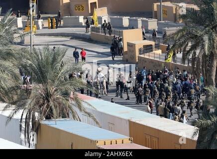 Baghdad, Iraq. 01st Jan, 2020. Assailants and attackers storm the entry control point at the U.S. Embassy in Baghdad, Iraq, on January 1, 2020. Dozens of angry Iraqi Shiite militia supporters broke into the U.S. Embassy compound in Baghdad on Tuesday, December 31, 2019, after smashing a main door and setting fire to a reception area. Photo by Maj. Charlie Dietz/U.S. Army/UPI Credit: UPI/Alamy Live News Stock Photo