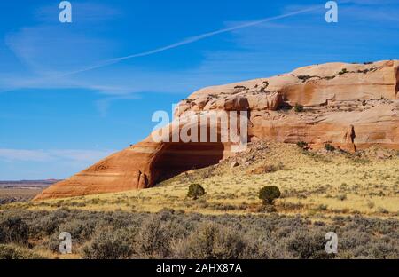A natural rounded cave shows the beauty of the sandstone's colors and patterns. Stock Photo