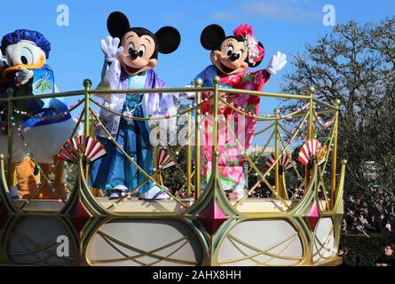 Urayasu, Japan. 1st Jan, 2020. Disney characters Mickey and Minnie Mouse in traditional kimono dresses greet guests from a float during a New Year's Day parade at the Tokyo Disneyland in Urayasu, suburban Tokyo on Wednesday, January 1, 2020. Credit: Yoshio Tsunoda/AFLO/Alamy Live News Stock Photo