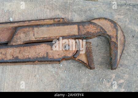 vintage rusty pipe wrench isolated on white background, top view Stock Photo