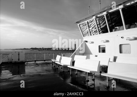Winter ferry crossing on Wightlink Ferries from Portsmouth to Fisbourne on the Isle of Wight near sunset in windy weather conditions Stock Photo