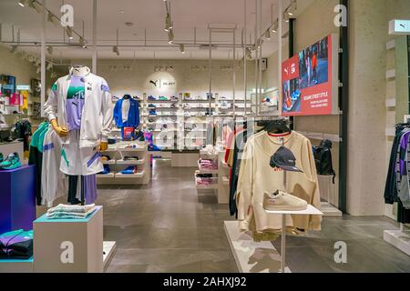 SINGAPORE CIRCA APRIL 2019 clothes and footwear on display at Puma Select store in the Shoppes at Marina Bay Sands Stock Photo Alamy