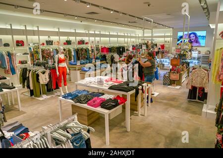 SINGAPORE - CIRCA APRIL, 2019: clothes on display at Zara store in the  Shoppes at Marina Bay Sands Stock Photo - Alamy