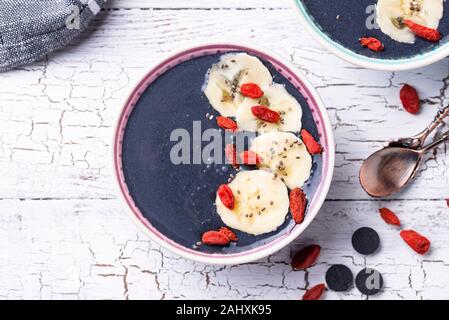 Black charcoal smoothie with goji Stock Photo