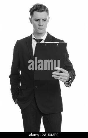 Young handsome businessman with curly hair wearing suit Stock Photo