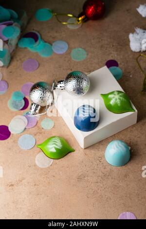 Holiday chocolate cand close-up and christmas decorations Stock Photo
