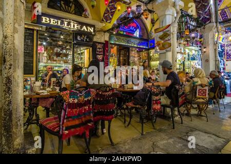 People are sitting at a restaurant inside the Grand Bazaar, Kapalıçarşı, one of the largest and oldest covered markets in the world Stock Photo