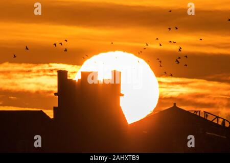Southport, Merseyside, 2nd January 2020.   The unseasonably warm weather continues as the morning sun rises over the historic landmarks along the promenade in Southport on Merseyside.  Credit: Cernan Elias/Alamy Live News Stock Photo