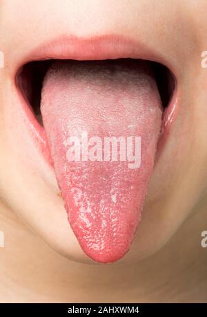 Human tongue protruding out Stock Photo - Alamy