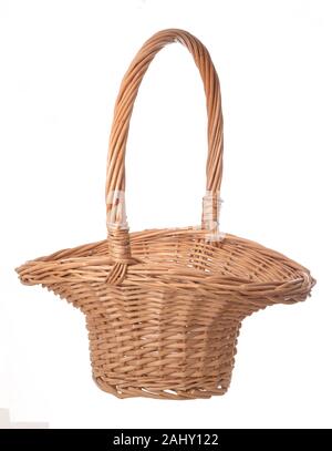 Flared, Little Bo Peep style wicker basket, for gathering flowers etc. Here empty, isolated on white background. With handle. Stock Photo
