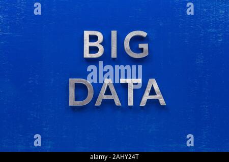the words big data laid with silver metal characters on blue painted wooden board in central flat lay composition Stock Photo