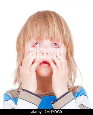 boy with long blond hair making scary faces - isolated on white Stock Photo