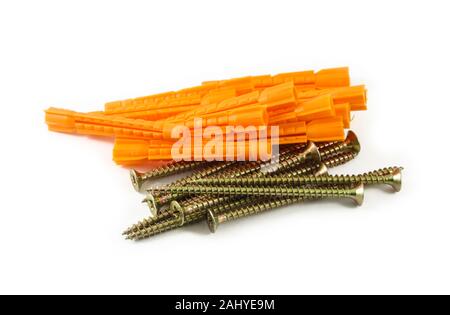 Handful of plastic dowels and self-tapping screws isolated on white background Stock Photo
