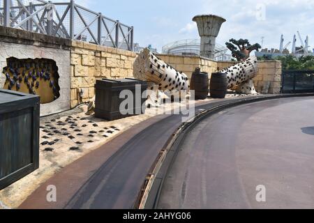 Universal Studios Singapore, Asia, 11th august 2019: Several Scorpios on rounded rock with empty road Stock Photo