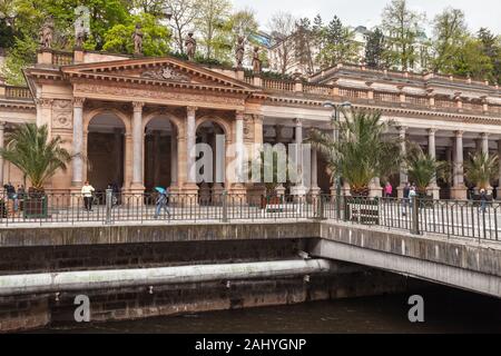 Karlovy Vary, Czech Republic - May 5, 2017: Ordinary people are near gallery with mineral water