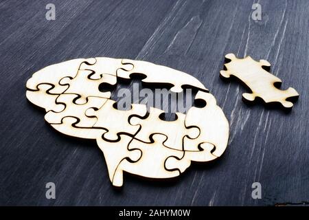 Brain from wooden puzzles. Mental Health and problems with memory. Stock Photo
