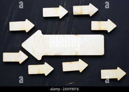 Stand out from the crowd concept. Arrows directed in the opposite direction. Stock Photo