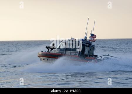 A tactical boat crew aboard 29-foot Response Boat — SMALL II assigned to the Coast Guard Maritime Safety and Security Team Los Angeles/Long Beach maneuvers in the water during a training exercise held off the coast of San Diego, Nov. 5, 2019. Coast Guard Maritime Security Response Team West personnel led a visit, board, search and seizure exercise and included teams from MSRT West, Pacific Tactical Law Enforcement Team, MSST LA/LB, National Strike Force’s Pacific Strike Team and the Coast Guard Cutter Terrell Horne who participated in the training scenarios over the course of two days. U.S. Co Stock Photo