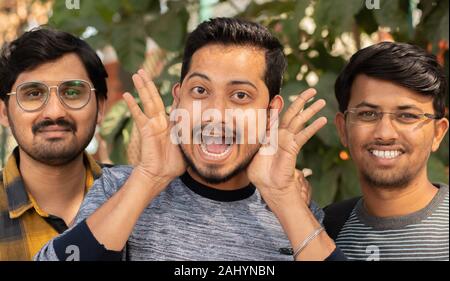 Joyful excited best friends with funny faces posing to camera - Close up Portrait of cheerful happy people - Concept of happy friendship and having Stock Photo