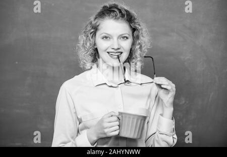 Peaceful morning. good morning. girl refreshing with tea drink. school teacher need coffee break. woman with coffee cup at blackboard. idea and inspiration. energy and vigor. energy charge. Stock Photo