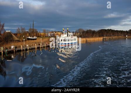 Zingst, Germany. 28th Dec, 2019. View from an excursion boat to the harbour of Zingst at the Zingst river with the excursion boat Baltic Star, a replica of a Mississippi paddle steamer. Credit: Jens Kalaene/dpa-Zentralbild/ZB/dpa/Alamy Live News Stock Photo