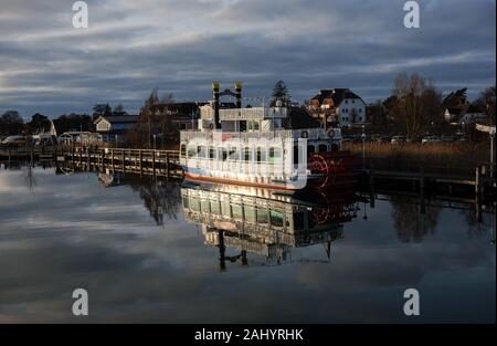Zingst, Germany. 28th Dec, 2019. View from an excursion boat to the harbour of Zingst at the Zingster Strom with the excursion boat Baltic Star, a replica of a Mississippi paddle steamer. Credit: Jens Kalaene/dpa-Zentralbild/ZB/dpa/Alamy Live News Stock Photo