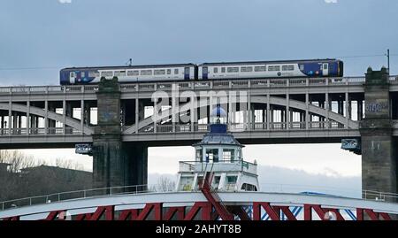 A Northern train travels along the High Level Bridge which carries both rail and road traffic across the Tyne between Newcastle upon Tyne and Gateshead, on the day that transport Secretary Grant Shapps signalled he wants to remove the franchise from Northern, warning he is “simply not prepared” for the service to carry on as it is. Stock Photo