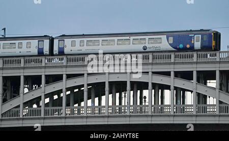 A Northern train travels along the High Level Bridge which carries both rail and road traffic across the Tyne between Newcastle upon Tyne and Gateshead, on the day that Transport Secretary Grant Shapps signalled he wants to remove the franchise from Northern, warning he is “simply not prepared” for the service to carry on as it is. Stock Photo