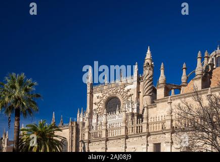 Seville Cathedral against background of deep blue sky, central rose window Stock Photo