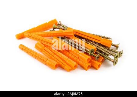 Handful of plastic dowels and self-tapping screws isolated on white background Stock Photo