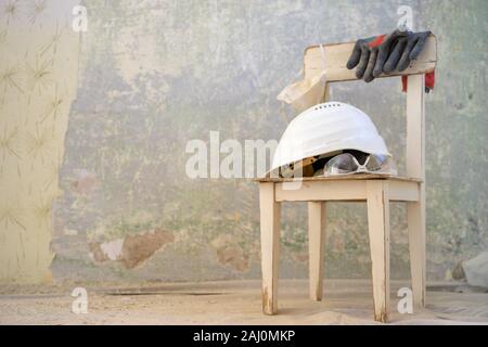 5Chair with protective equipment on it, ready for renovation Stock Photo