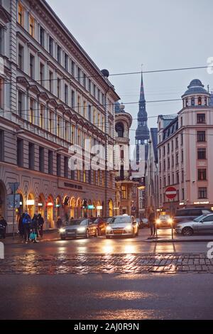 Rainy autumn evening in street of Old Town Riga, Latvia. Stock Photo