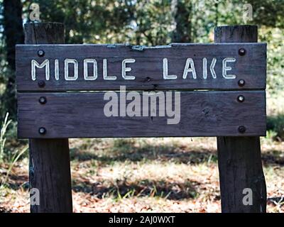 Conroe, TX USA - 11/15/2019  -  Middle Lake Wooden Sign Stock Photo