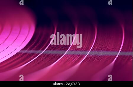 Old colorful Vynil disc playing music, background image Stock Photo