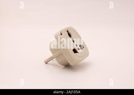 Universal travel adapter, worldwide wall AC Power Plug Adapter for USA EU UK AUS isolated on white background Stock Photo