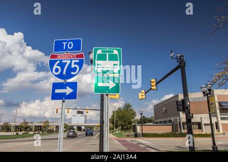 Saginaw, Michigan, USA - October 9, 2018: Streets of downtown Saginaw with signs for bus station and Interstate 75. Stock Photo