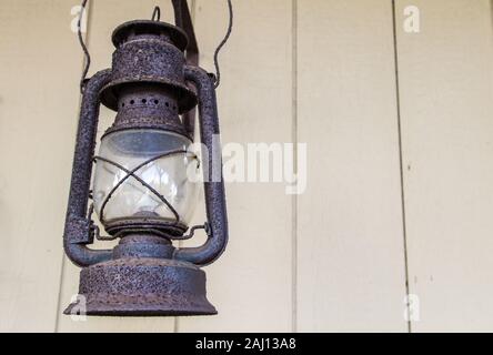 Antique Lantern. Rusted antique lantern in horizontal orientation with copy space. Stock Photo